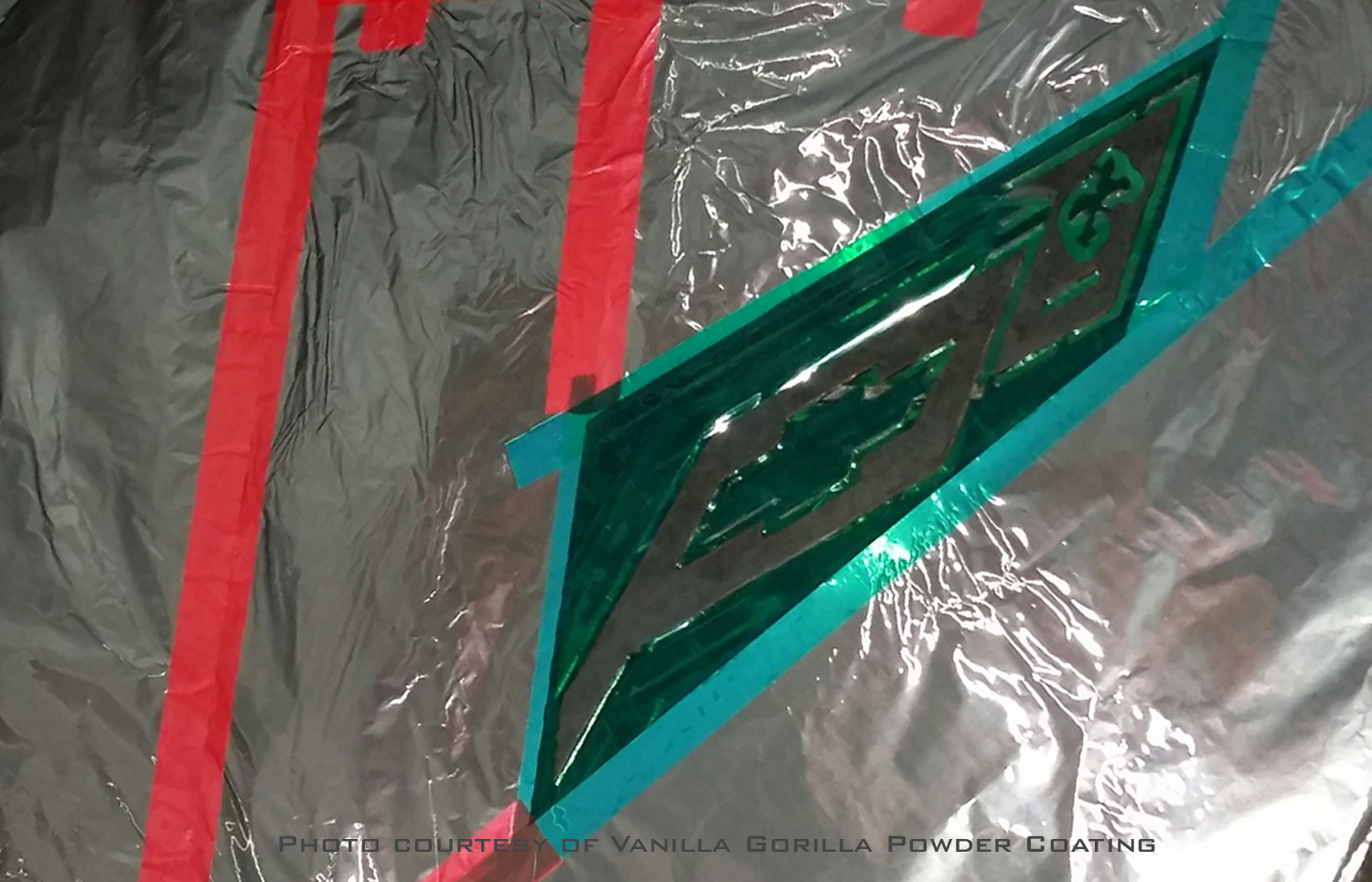Applying green polyester masking tape for two-tone powder coating