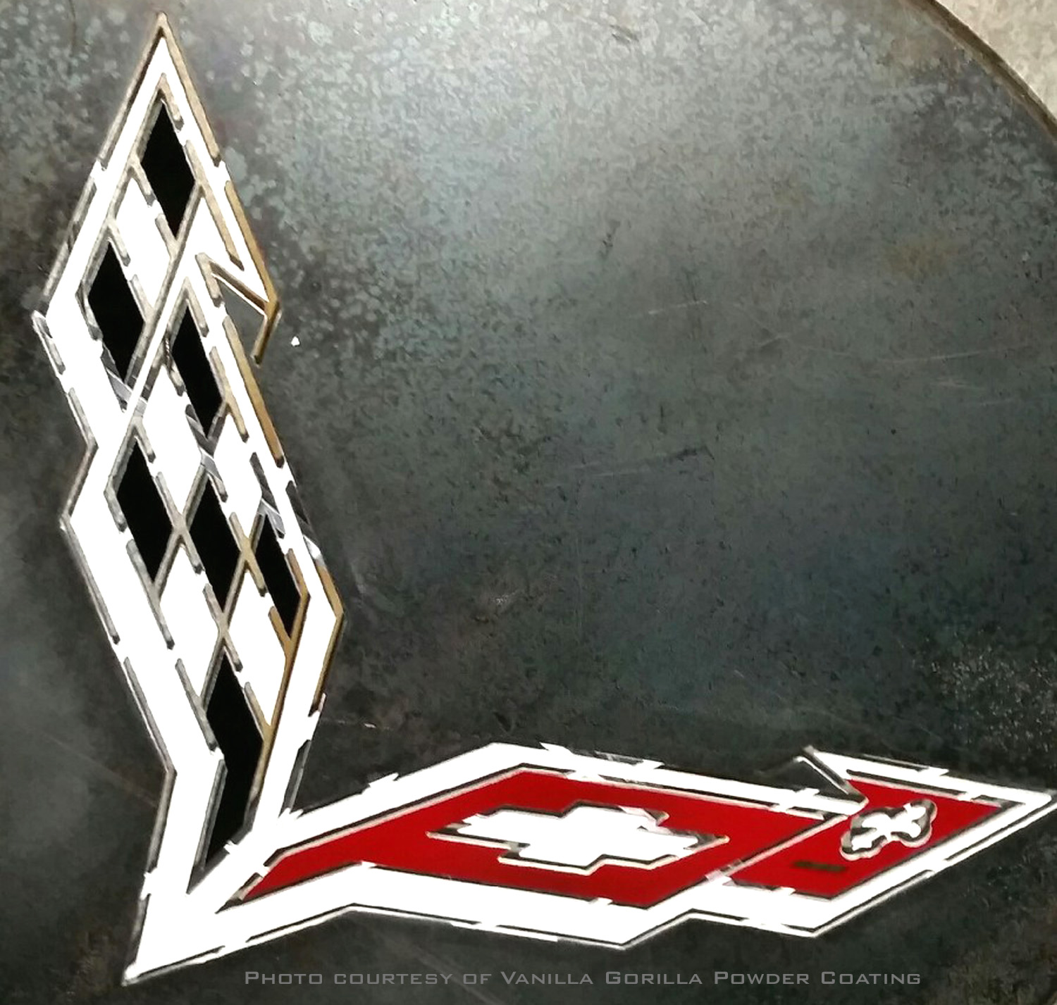 Table ready for silver-vein grey coat with Corvette symbol masked