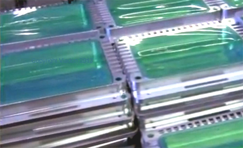 Metal parts masked with green polyester tape